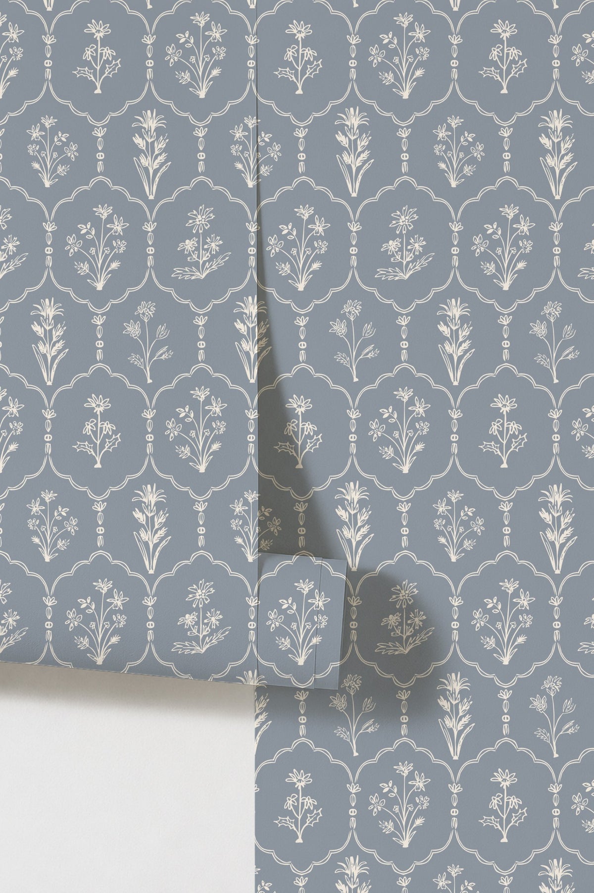 Dusty blue wallpaper with white floral trellis pattern in elegant style.