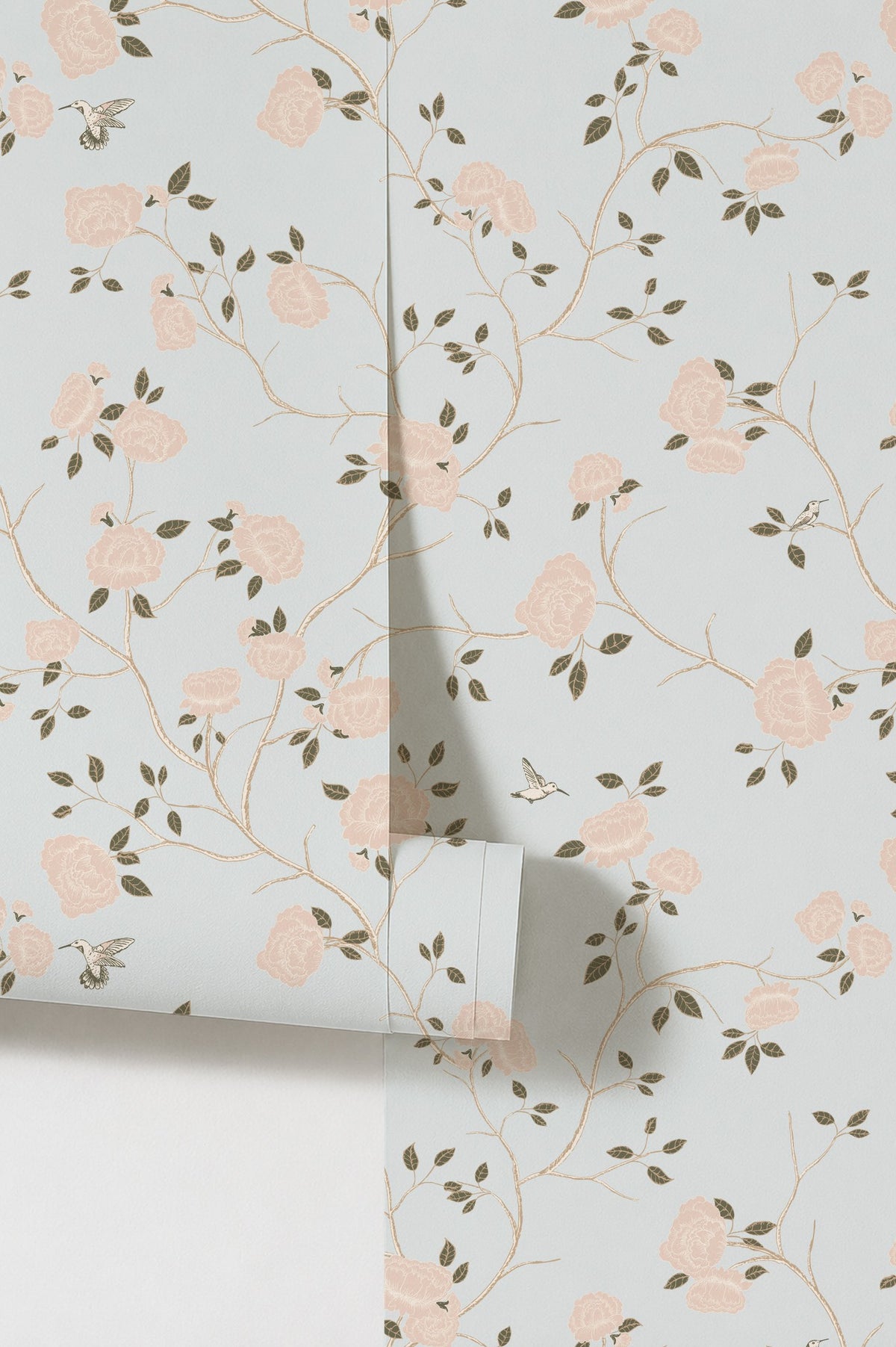 Blue wallpaper with pink roses and green vines in chinoiserie style.