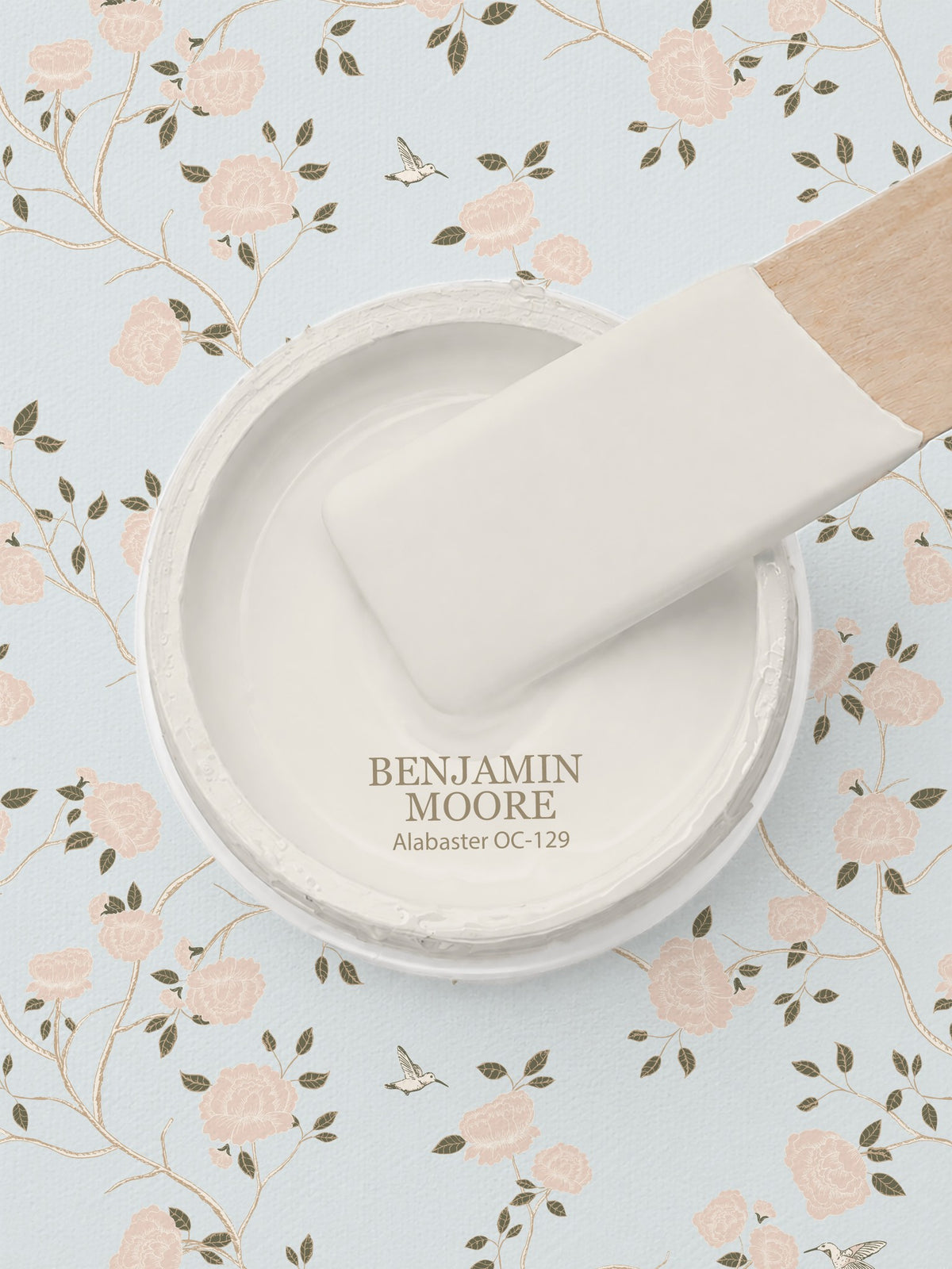 Blue wallpaper with pink roses and vines, Benjamin Moore paint sample.