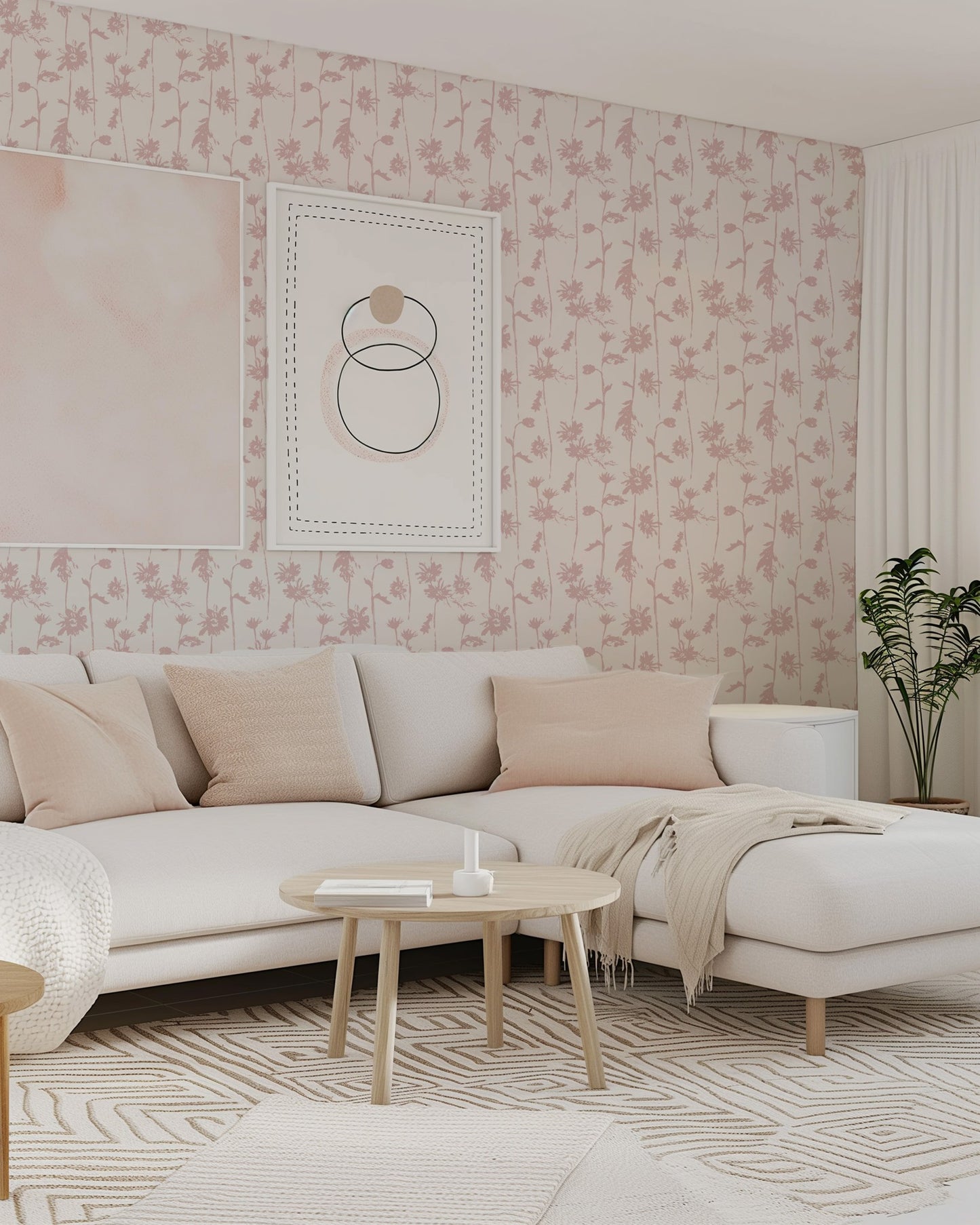 Blush pink floral wallpaper in modern living room with cream sofa and decor.