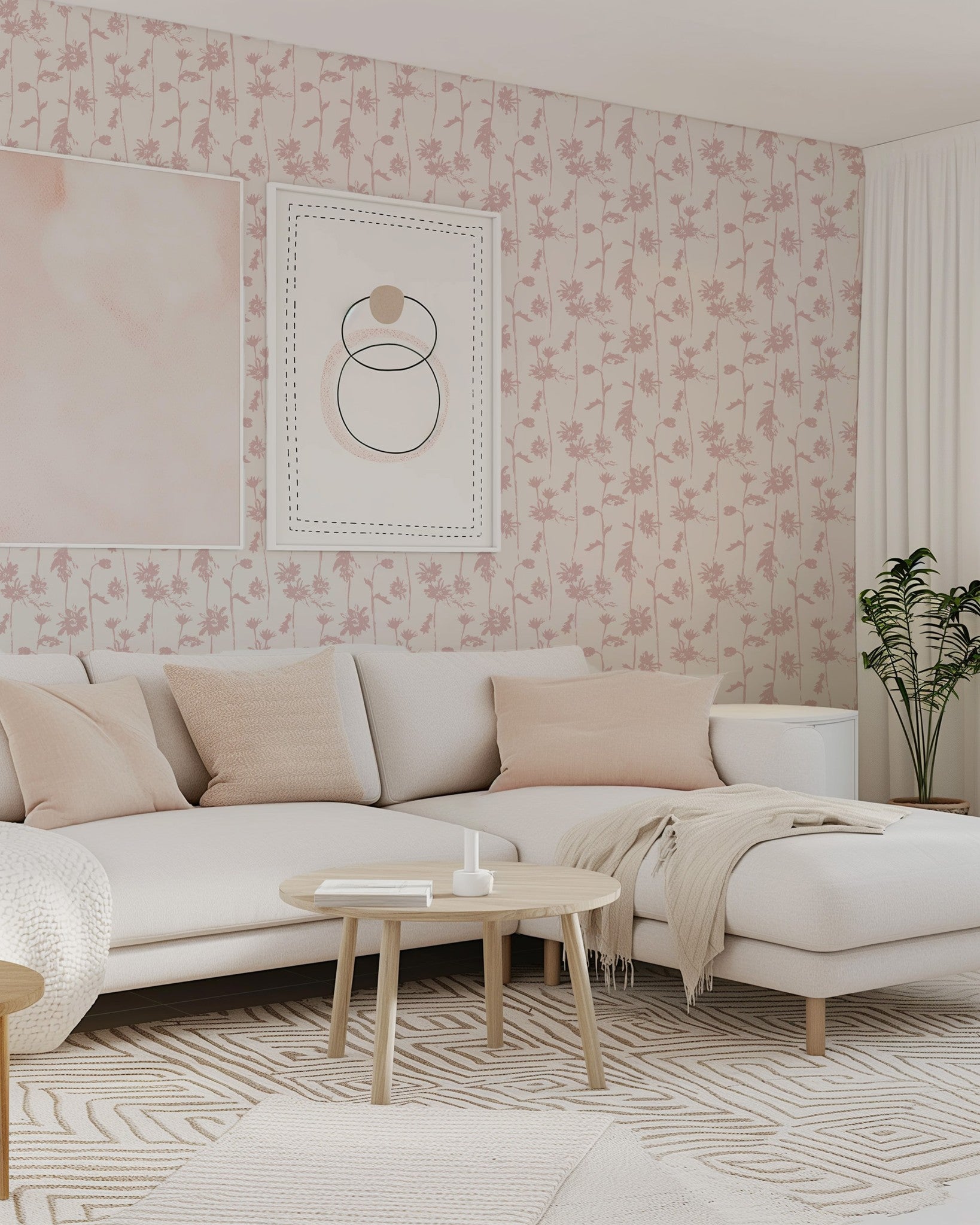 Blush pink floral wallpaper in modern living room with cream sofa and decor.