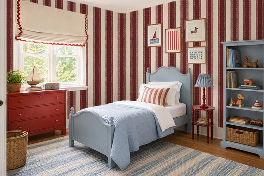 Burgundy striped wallpaper with lace details in a cozy bedroom setting.