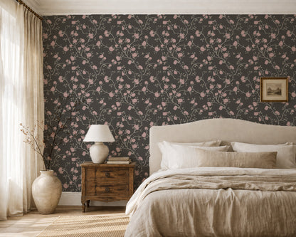 Charcoal wallpaper with pink floral and hummingbird pattern in a cozy bedroom setting.