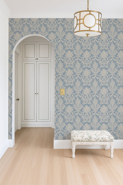 Chateau blue and tan damask wallpaper in elegant hallway with arch and bench.