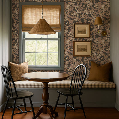 Cherie charcoal cherry blossom wallpaper in cozy dining nook with wooden table and chairs.
