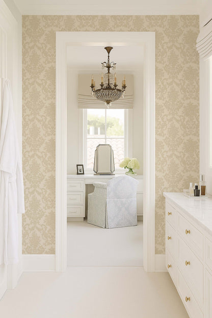 Cream damask wallpaper in elegant bathroom with chandelier and vanity.