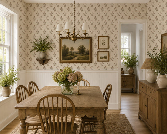 Cream and pink thistle print wallpaper in rustic dining room with wooden furniture.