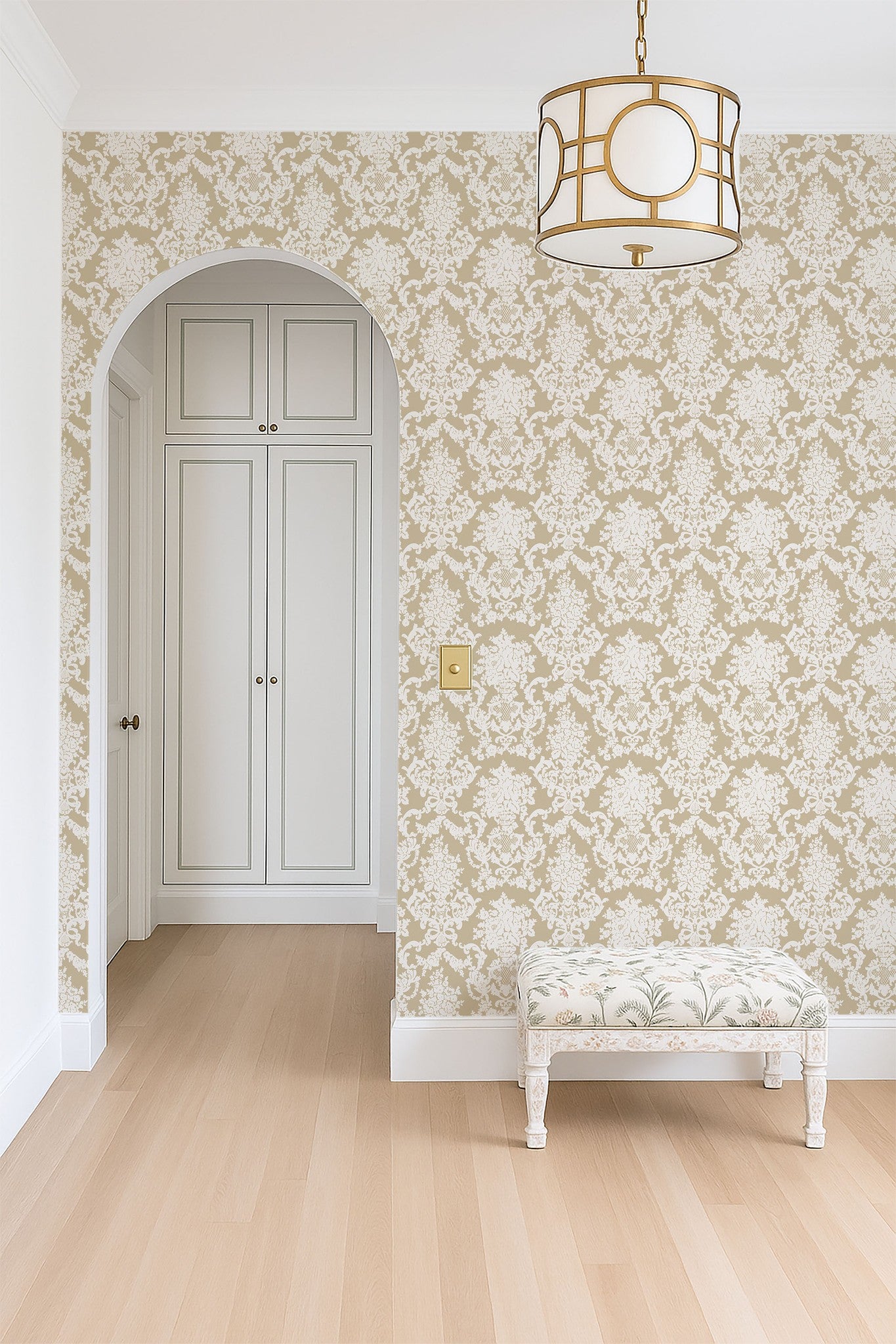Elegant damask wallpaper in cream and white with ornate pattern in a classic hallway setting.