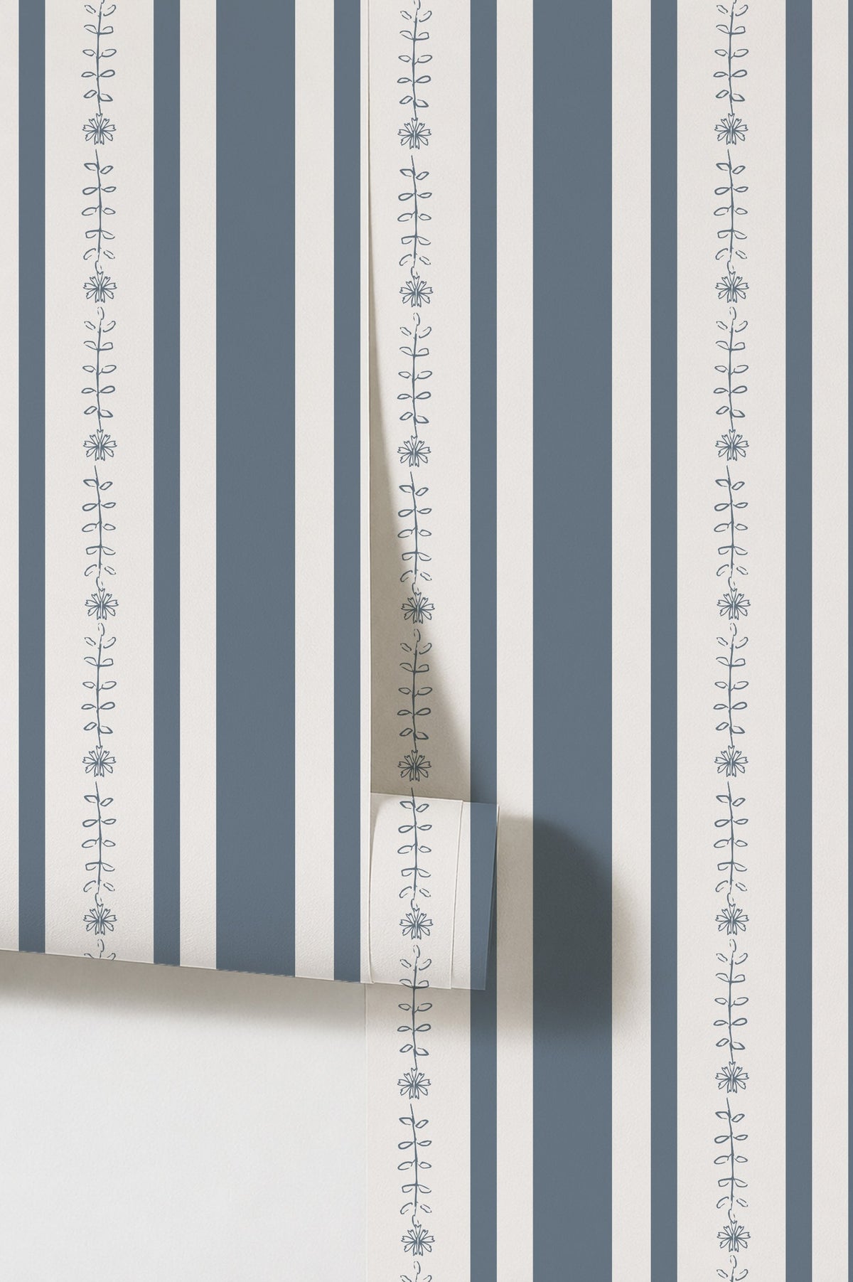 Dark blue and white floral stripe wallpaper with delicate motifs.