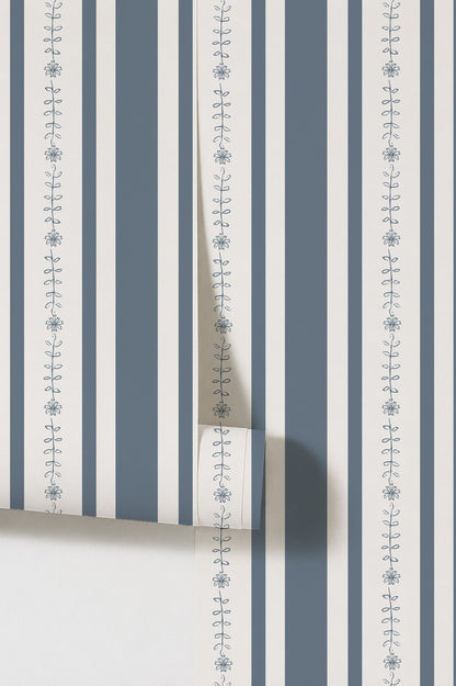 Dark blue and white floral stripe wallpaper with delicate motifs.