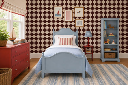Diamond red wallpaper with chocolate brown and cream diamonds in a cozy bedroom setting.