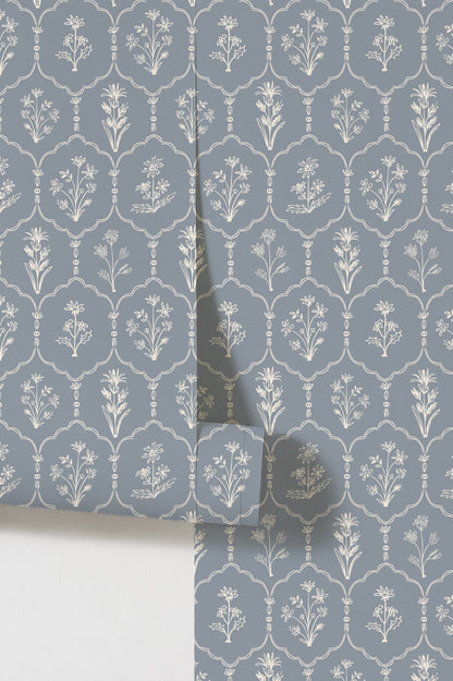 Dusty blue wallpaper with white floral trellis pattern in elegant style.