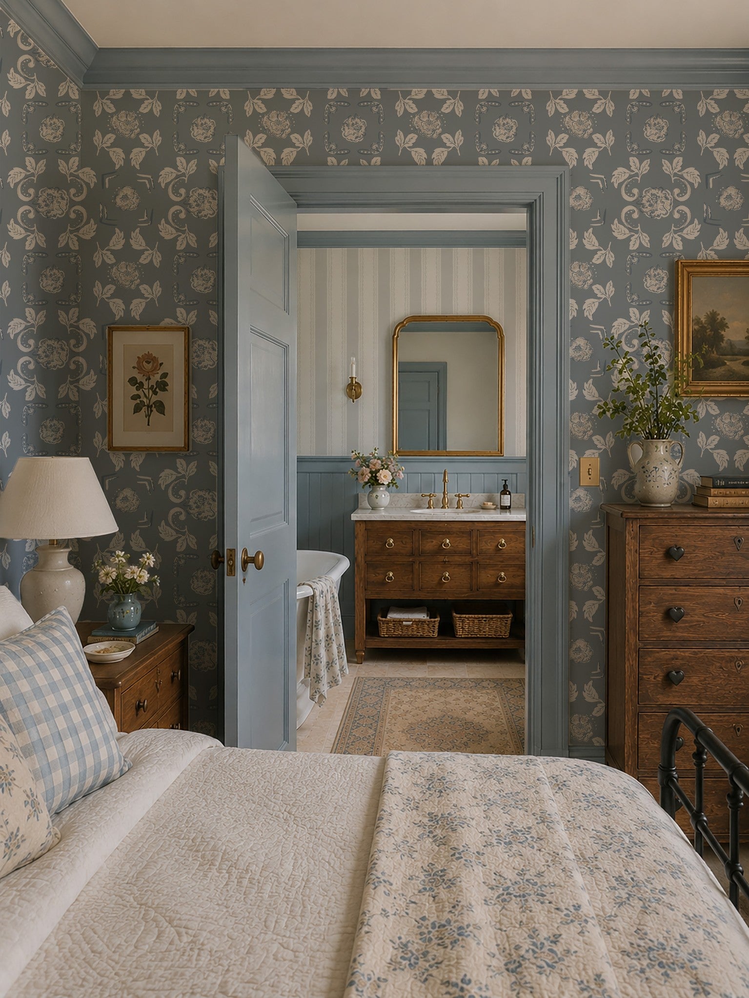 Dusty blue floral wallpaper in vintage bedroom with wooden furniture and soft lighting.