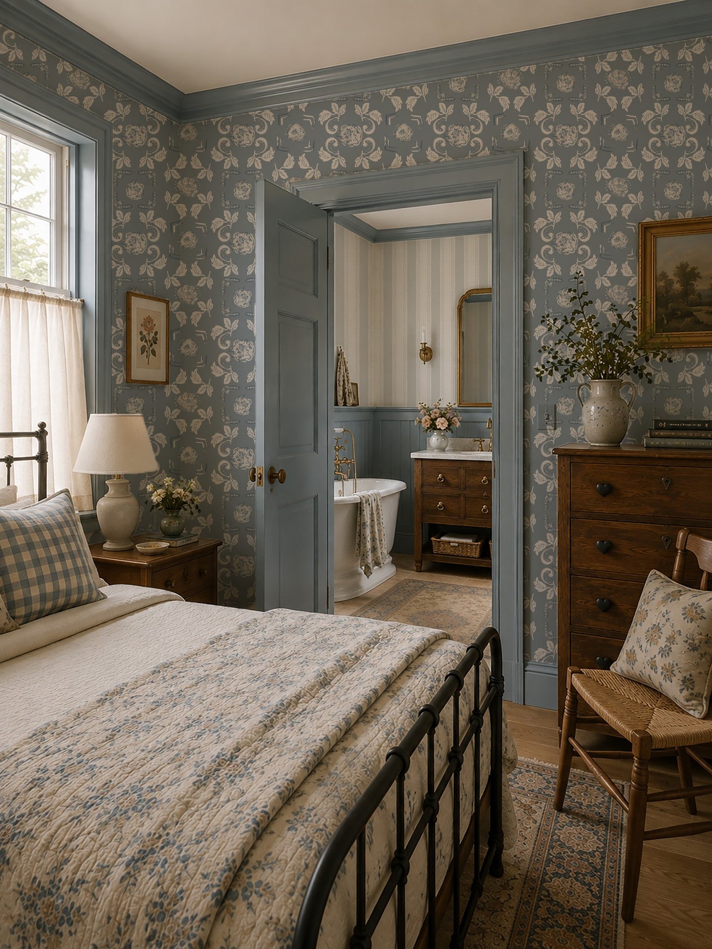 Vintage bedroom with dusty blue floral wallpaper and antique decor.