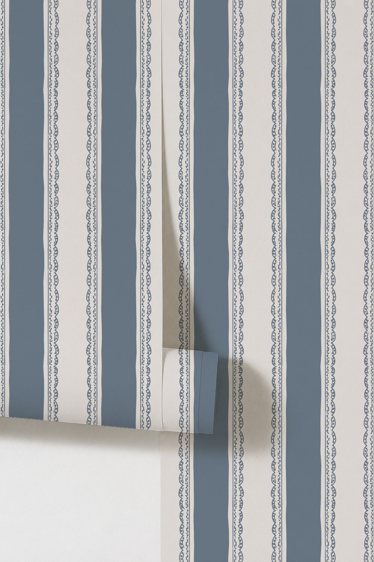 Dusty blue striped wallpaper with lace borders in a classic design.