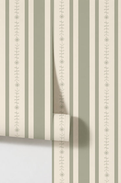 Emma floral stripe olive wallpaper with sage and white vertical stripes and vine pattern.