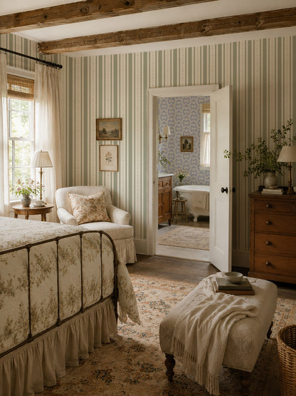 Emma Floral Stripe Olive wallpaper in cozy bedroom with vintage decor and wood beams.