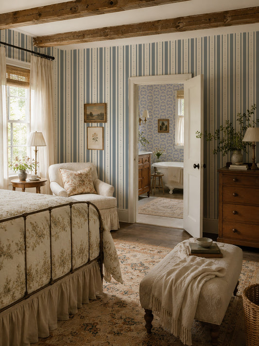 Slate blue and white striped floral wallpaper in vintage bedroom with wooden beams.
