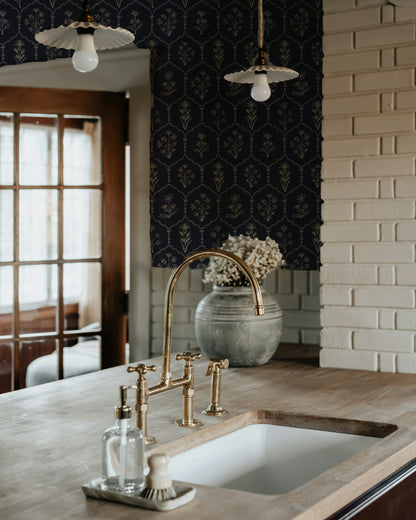 Floral Trellis Blue wallpaper in rustic kitchen with brass fixtures.