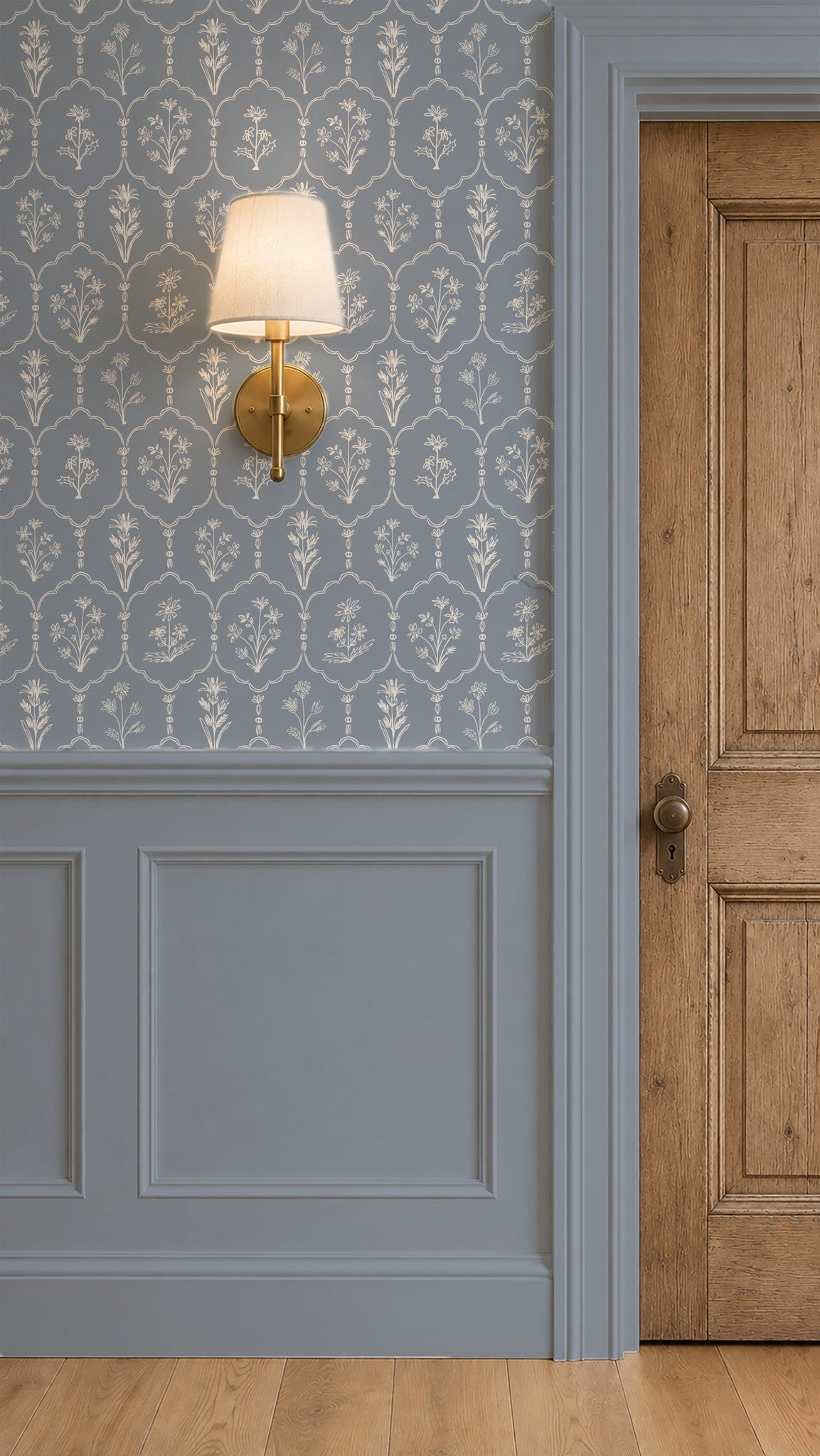 Floral trellis dusty blue wallpaper with white flowers in elegant room setting.