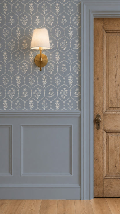 Floral trellis dusty blue wallpaper with white flowers in elegant room setting.