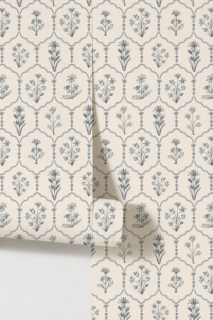 Floral trellis white wallpaper with blue botanical motifs on cream background.