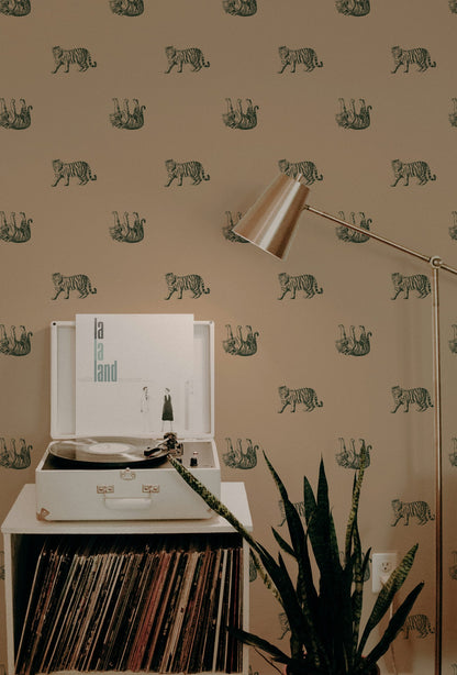 Green tiger pattern wallpaper in a cozy living room with a record player and floor lamp.
