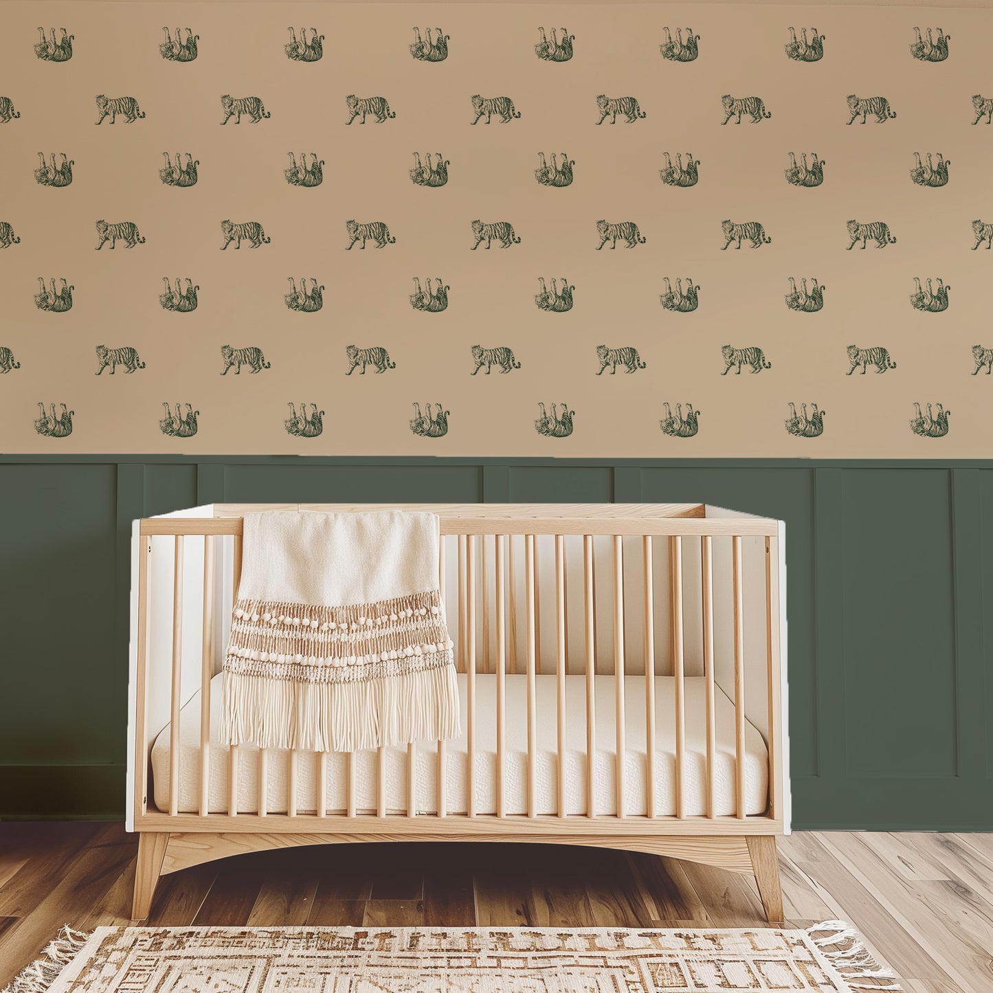 Green tiger pattern wallpaper in nursery with wooden crib and green wainscoting.