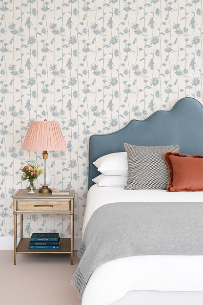 Jocelyn blue and cream floral wallpaper in elegant bedroom setting.