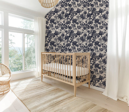 Jungle Toile Blue wallpaper in a nursery with a wooden crib and large windows.