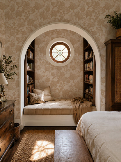 Jungle Toile Cream wallpaper with sepia jungle scene in cozy reading nook.