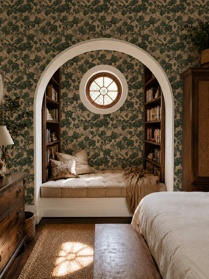 Jungle Toile Green wallpaper with tropical foliage in cozy bedroom nook.