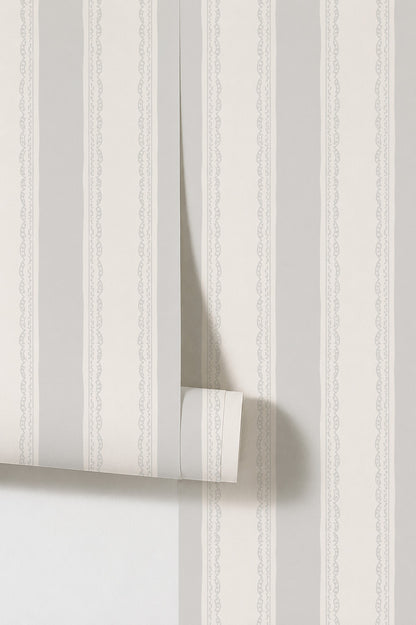 Lacey Stripe Light Blue wallpaper with soft grey stripes and lace borders.