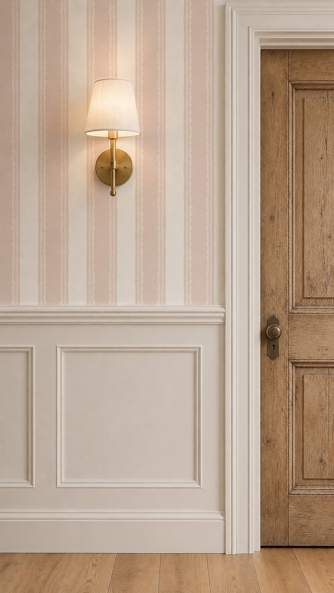 Pink and cream striped wallpaper with lace detail in a vintage room setting.