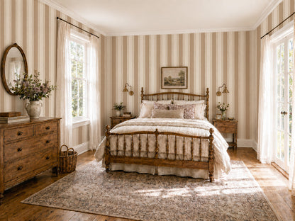 Bedroom with Lacey Stripes Tan wallpaper featuring beige and cream stripes, vintage decor.