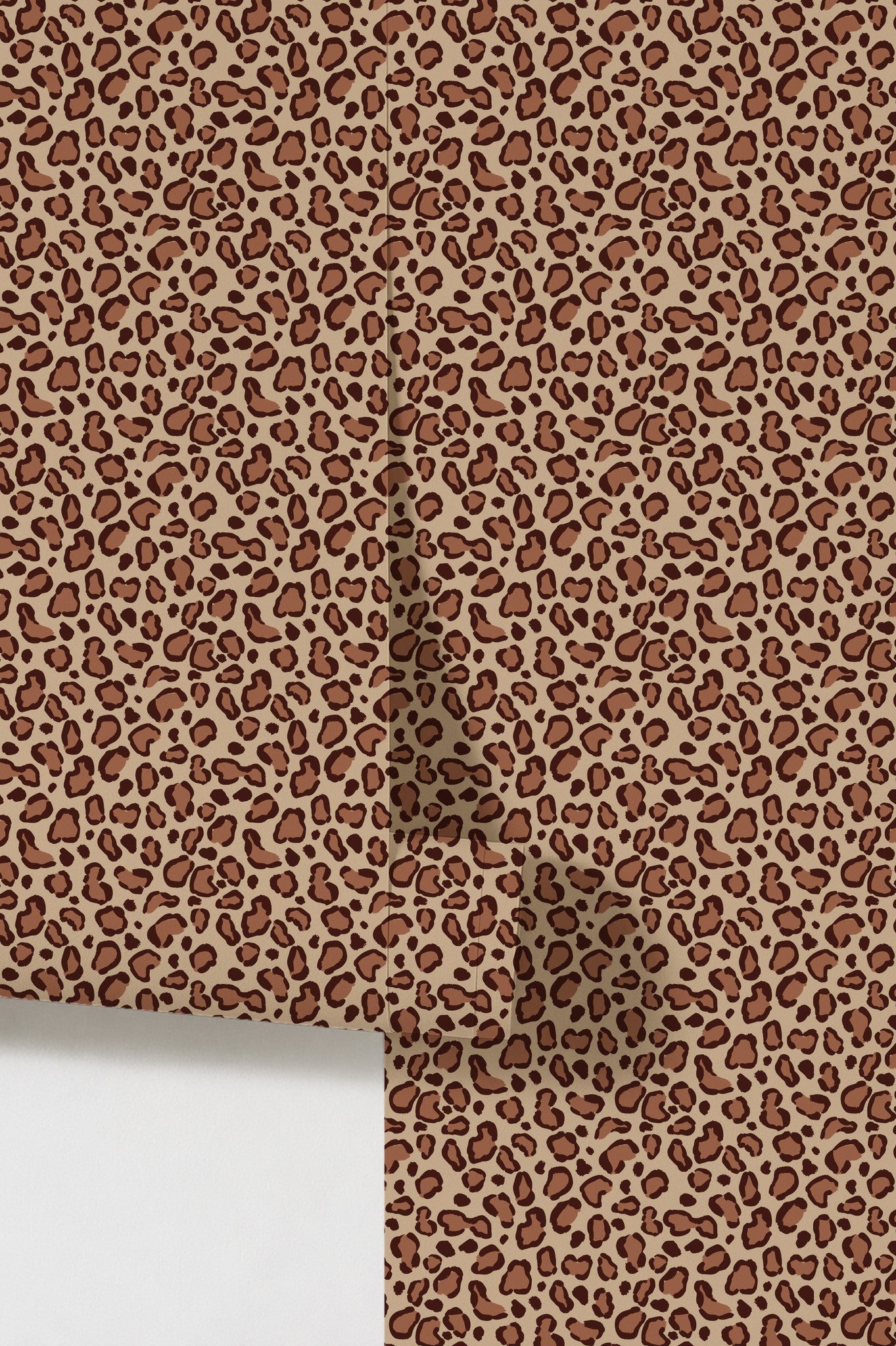 Leopard print brown wallpaper with bold spots on beige background.