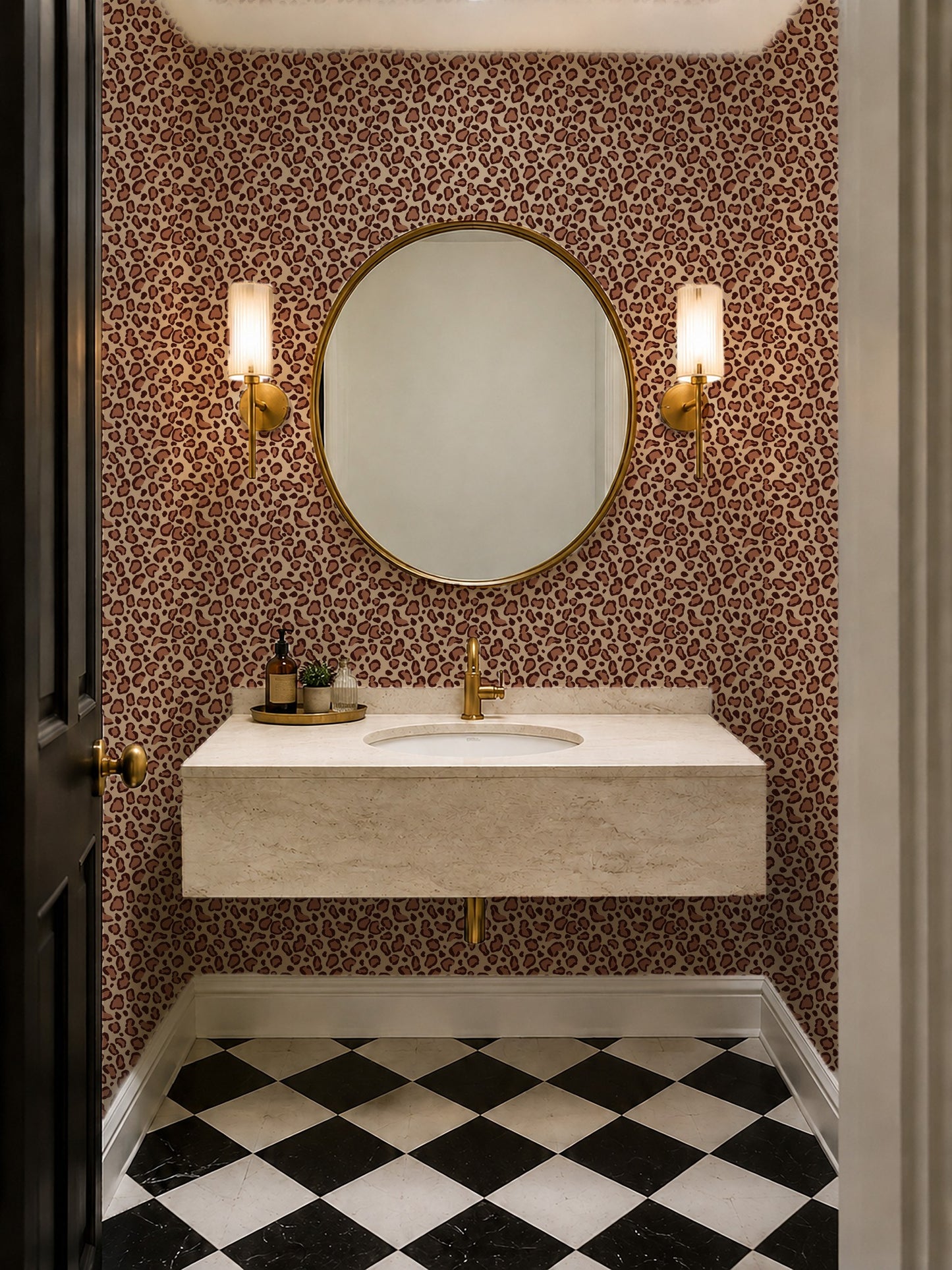 Leopard print brown wallpaper in modern bathroom with round mirror and sconces.
