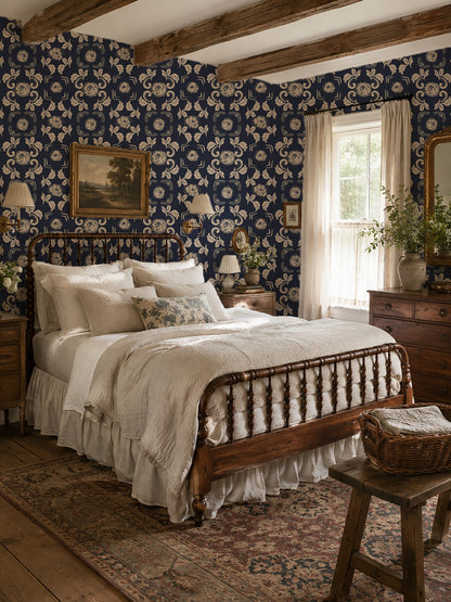 Navy floral wallpaper in cozy vintage bedroom with wooden bed and decor.