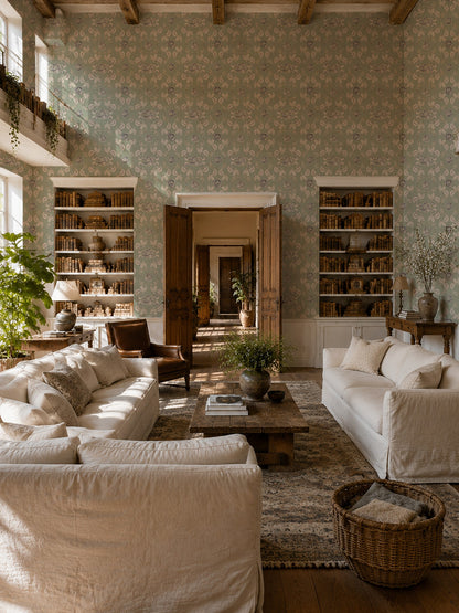 Nora Delft Green floral wallpaper in elegant vintage living room with white sofas.