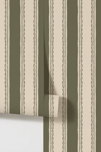Olive green and cream striped wallpaper with lace detailing.