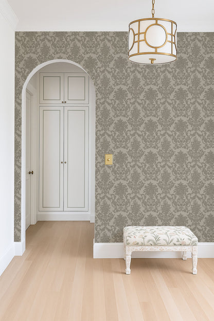 Olive green damask wallpaper in elegant hallway with arch and vintage bench.