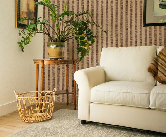Organic Stripes Red wallpaper in modern living room with beige sofa and plants.