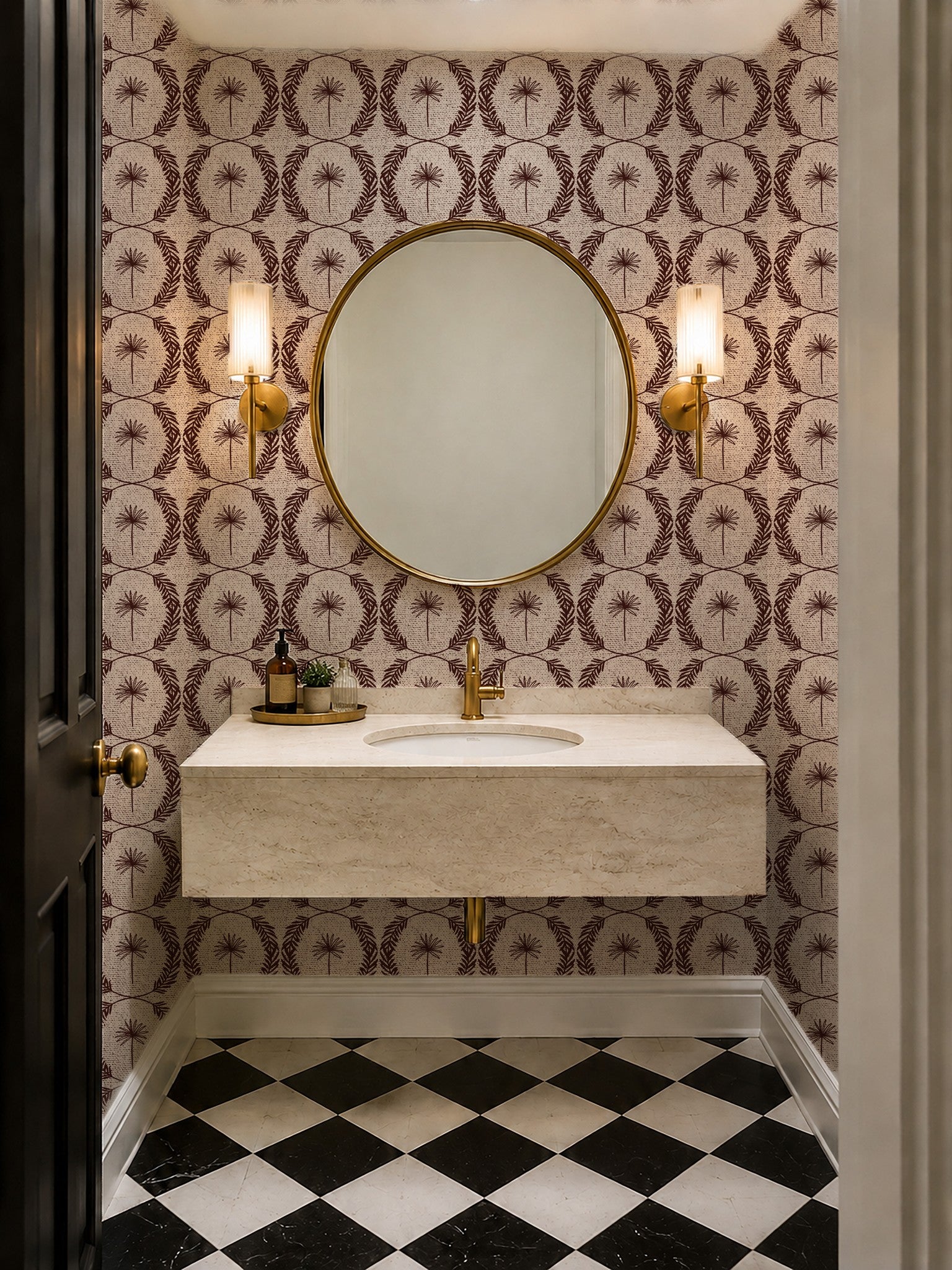 Palm Wreath Red wallpaper in elegant bathroom with round mirror and sconces.