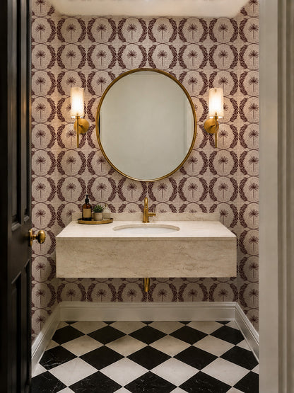 Palm Wreath Red wallpaper in elegant bathroom with round mirror and sconces.