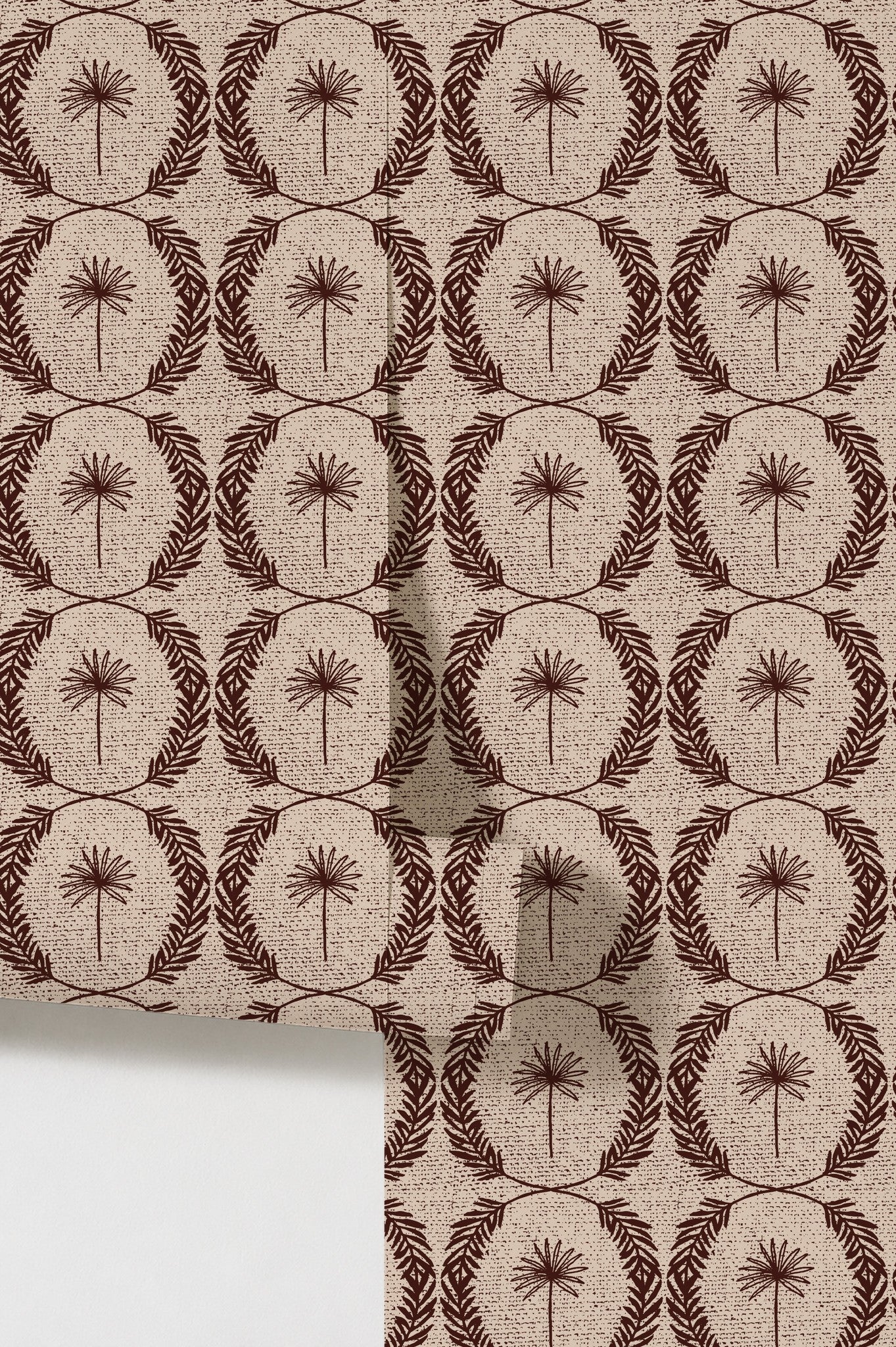 Palm wreath red wallpaper with mahogany palm motifs on beige background.