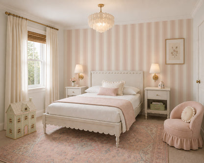 Pink and cream striped wallpaper in elegant vintage bedroom with white furniture.
