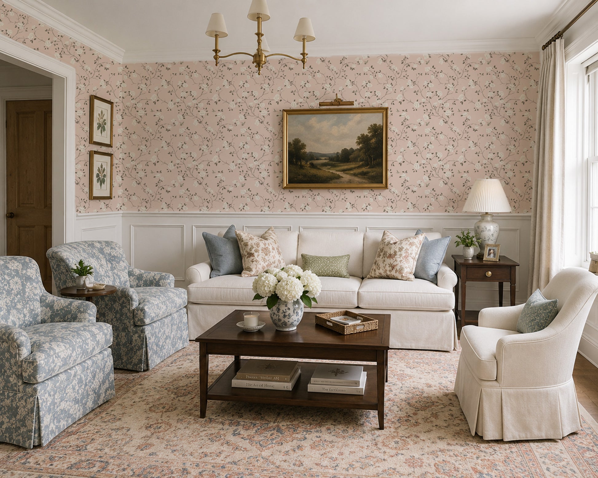 Living room with pink floral chinoiserie wallpaper, elegant furniture, and vintage decor.