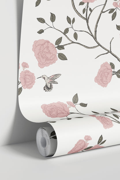 Pink floral and hummingbird wallpaper roll with branches and leaves.