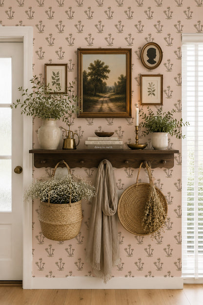 Pink floral wallpaper with botanical motif in cozy living room setting.