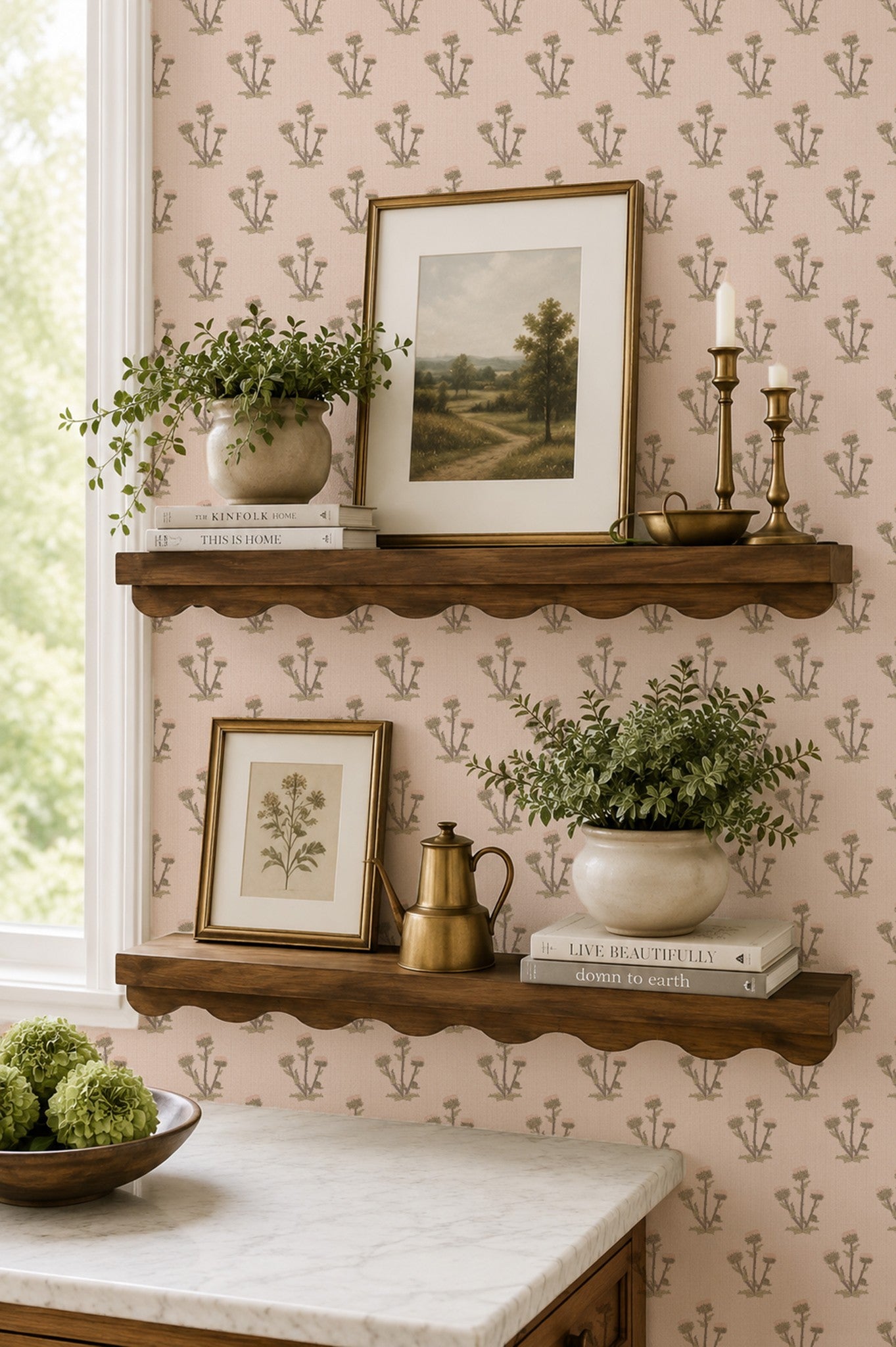 Pink floral wallpaper with botanical motif in a vintage styled room with wooden shelves and decor.
